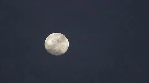 Moonset behind fast moving clouds time lapse Stock Footage 295800493