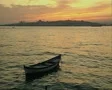 Moored boat in river at dusk SD Footage