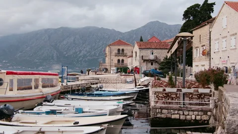 Moored Boats at Harbour With Mountains Backdrop, Perast, Montenegro 動画素材 337302390
