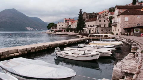 Moored Boats at Mountain Backdrop Framed Waterfront, Perast, Montenegro Stock Footage 337302677
