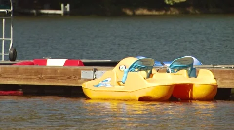 Moored paddle boat floating in river Stock Footage 54593451