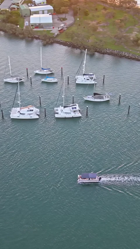 Moored yachts and small boat on Mooloolah River aerial view Queensland Stock Footage 334785745