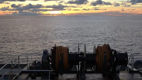 Mooring winch on the deck of a cargo ship on the move on the high seas Stock Footage 120141537