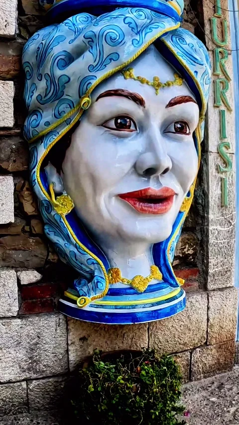 The Moor's head is a ceramic vase decorated and shaped in the shape of a head Stock Footage 334863642
