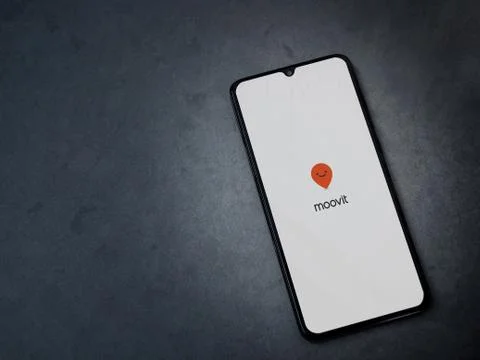 Moovit app launch screen with logo on the display of a black mobile smartphon Stock Photos