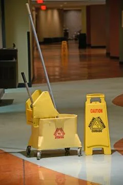 Mop With Caution Sign Stock Photos