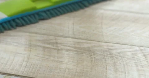 A mop cleans the laminate floor. Stock Footage 309115607