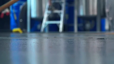 Mop on distillery floor cleaning after alcohol production Stock Footage 86710359