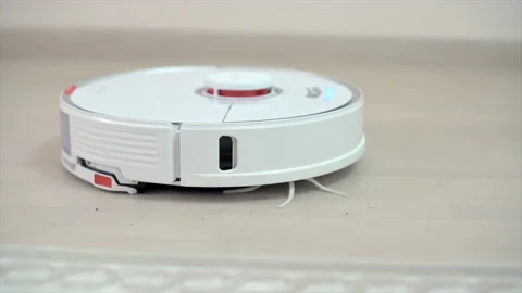 Mop vacuum robot cleaning black dirt and dust at home near carpet Stock Footage 205874909