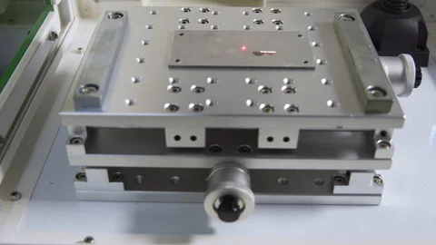 MOPA fiber laser machine engraving on a metal plate, tilt shot Stock Footage 101258708