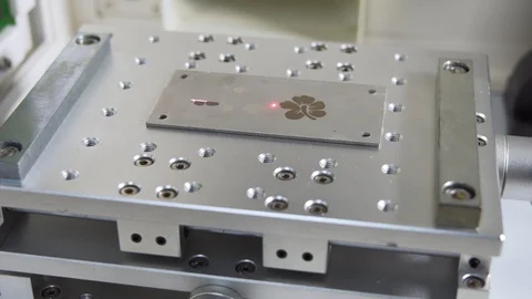 MOPA fiber laser machine engraving on a metal plate, gimbal shot Stock Footage 101258726