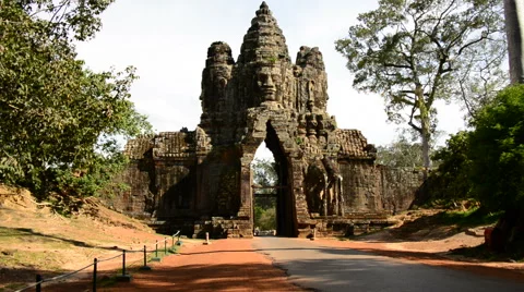 Mopeds Drive through Archway on Bridge - Angkor Wat Temple Stock Footage 42297877