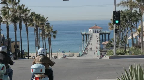 Mopeds going to Manhattan Beach Pier  Stock Footage 61151091