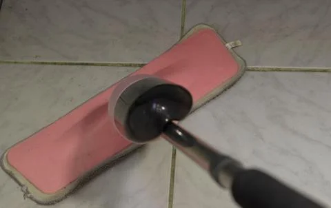 Mopping the floor in the bathroom Stock Photos