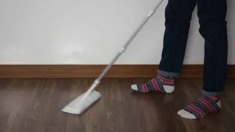 Mopping the floor using paper towel Stock Footage 130423860