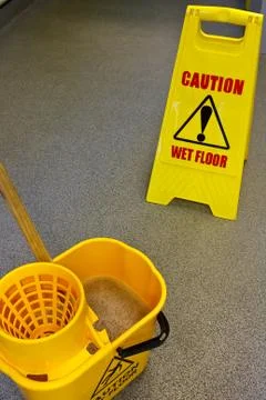 Mopping floor warning sign Stock Photos