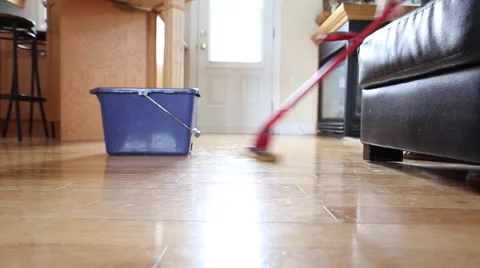 Mopping the hardwood floor Stock Footage 64937532