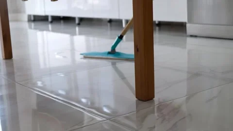 Mopping a Marble Floor at Home – Deep Cleaning and Floor Care Video stock 274885316