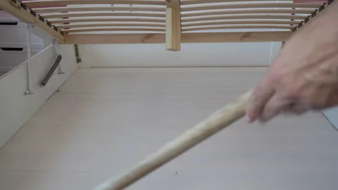 Mopping under the bed Video stock 315397784