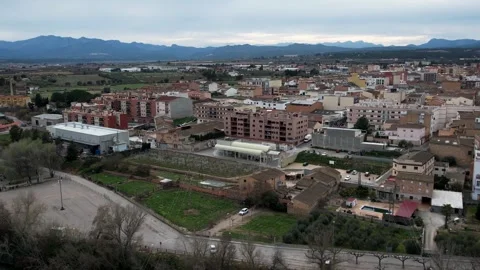 Mora de Ebro aerial view with village, river, and bridge in Catalonia, Spain 4K Stock Footage 308714817