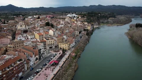 Mora de Ebro aerial view with village, river, and bridge in Catalonia, Spain 4K Видео 344546495