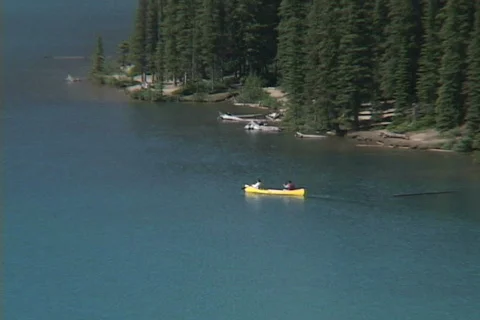 Moraine Lake canoe pull to WS Stock Footage 147951