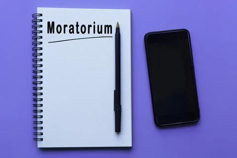 Moratorium text on notepad on purple background Stock Photos