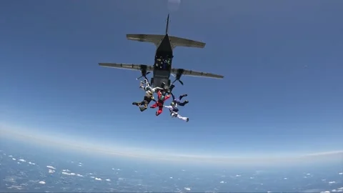More than 100 skydivers together in a large formation. Stock Footage 341271447