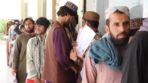More than 15,000 Afghans sign up for a program to work in Qatar, KANDAHAR, AF -  Stock Footage 314463943