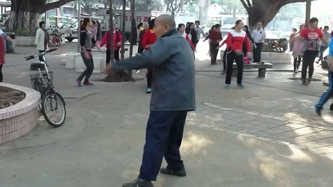 A more than 80 year old man danced with the women Stock Footage 70416847