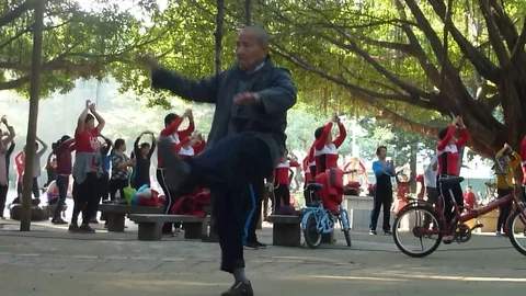A more than 80 year old man danced with the women Stock Footage 70418003