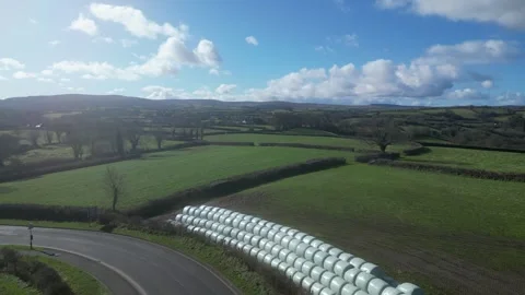 Moretonhampstead, Devon: DRONE VIEWS: Overhead shots of sealed hay bales (4) Stock Footage 264952394