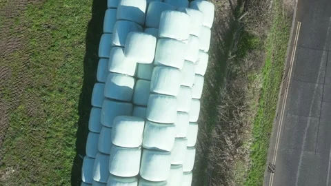 Moretonhampstead, Devon: DRONE VIEWS: Overhead shots of sealed hay bales (2) Stock Footage 264952446