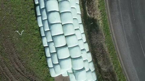 Moretonhampstead, Devon: DRONE VIEWS: Overhead shots of sealed hay bales (3) Stock Footage 264952454