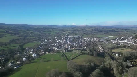 Moretonhampstead, Devon, England: DRONE VIEWS: Church, houses &amp; allotments (7) Stock Footage 264952173