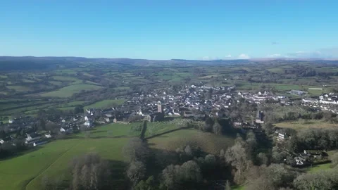 Moretonhampstead, Devon, England: DRONE VIEWS: Church, houses &amp; allotments (6) Stock Footage 264952311
