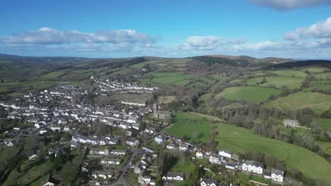 Moretonhampstead, Devon, England: DRONE VIEWS: Church, houses &amp; allotments (5) Stock Footage 264952630