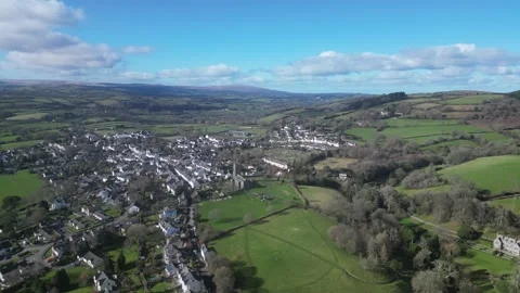 Moretonhampstead, Devon, England: DRONE VIEWS: Church, houses &amp; allotments (4) Stock Footage 264952656