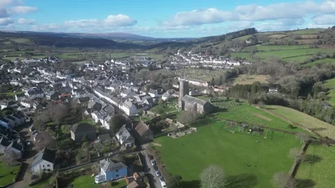 Moretonhampstead, Devon, England: DRONE VIEWS: Church, houses &amp; allotments (3) Stock Footage 264952674
