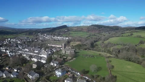 Moretonhampstead, Devon, England: DRONE VIEWS: Church, houses &amp; allotments (2) Stock Footage 264952692