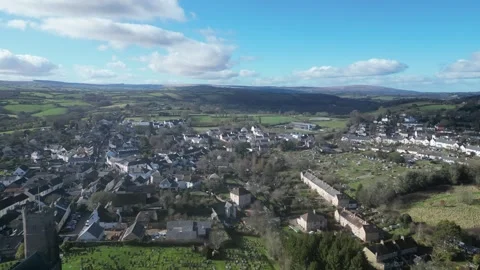 Moretonhampstead, Devon, England: DRONE VIEWS: Church, houses &amp; allotments (1) Stock Footage 264952700
