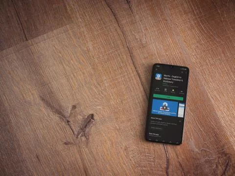 Morfix app play store page on the display of a black mobile smartphone on woo Stock Photos