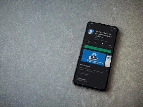 Morfix app play store page on the display of a black mobile smartphone on cer Stock Photos
