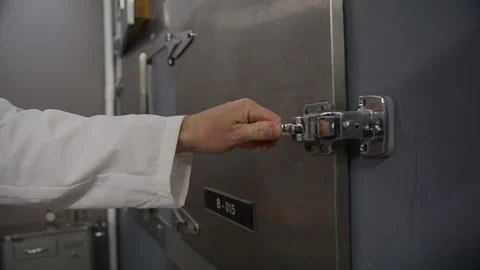 Morgue corpse closing the door Stock Footage 283834888