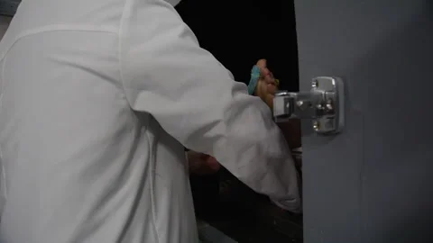 Morgue doctor taking corpse out of cooler Stock Footage 283614635