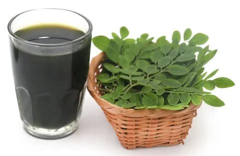 Moringa leaves with extract Stock Photos