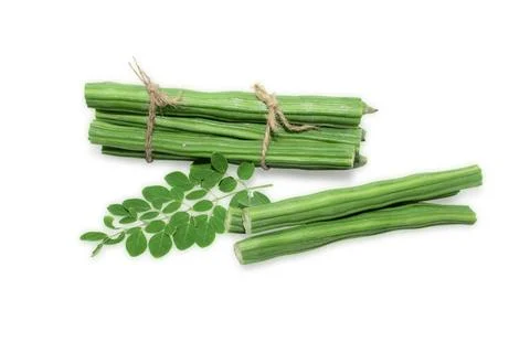 Moringa Oleifera or drumstick vegetable with leaves isolated over white bac.. Stock Photos