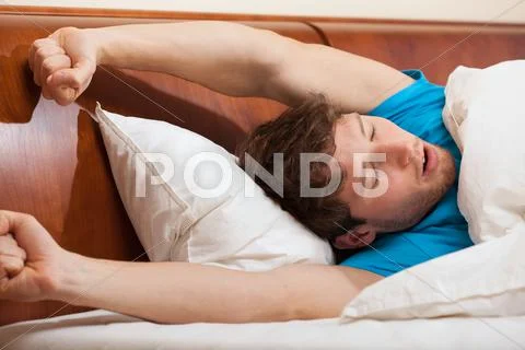 Morning bed stretching Stock Photos