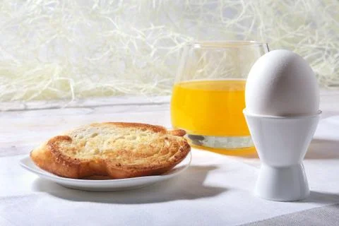 Morning Breakfast set with egg, bread toast and orange juice. Stock Photos