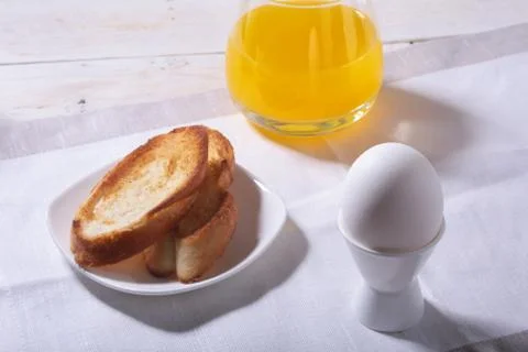 Morning Breakfast set with egg, bread toast and orange juice. Stock Photos